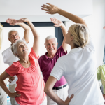 Occupational therapist helping senior improve balance and mobility to prevent falls at home
