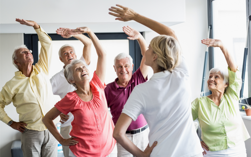 Occupational therapist helping senior improve balance and mobility to prevent falls at home
