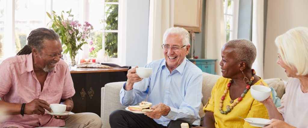 Senior engaging in healthy daily activities including gentle exercise, social interaction, balanced meals, and safe living habits to support overall wellness.