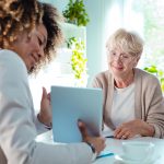 Senior-friendly home safety tips including clear walkways, proper lighting, non-slip mats, handrails, and supportive furniture to prevent falls and promote independence.