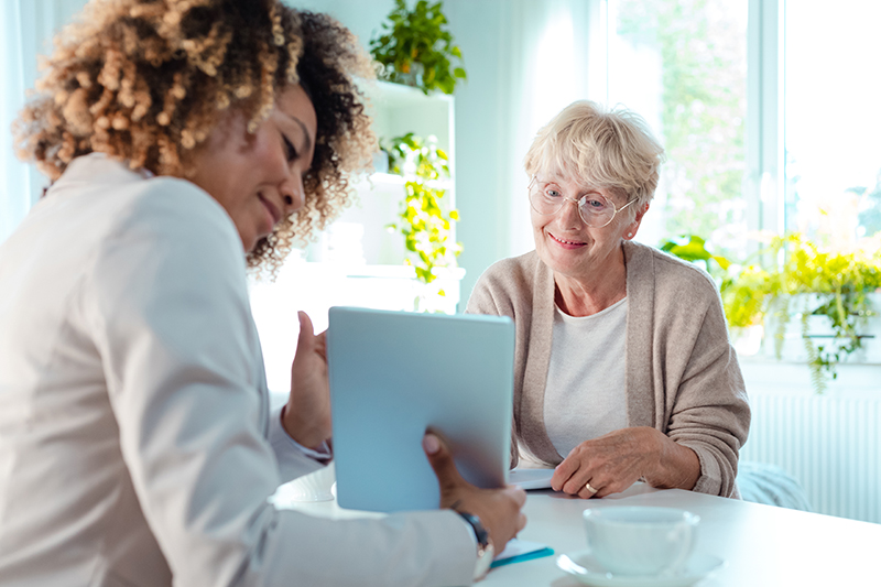 Senior-friendly home safety tips including clear walkways, proper lighting, non-slip mats, handrails, and supportive furniture to prevent falls and promote independence.