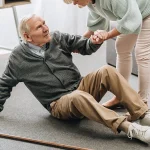 Essential home modifications for seniors including clear pathways, non slip flooring, grab bars, proper lighting, and bathroom safety equipment to prevent falls.