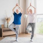 Senior performing balance exercises such as heel-to-toe walking and single-leg stands to improve stability and prevent falls.