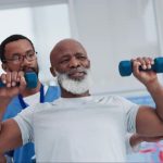 Senior performing strength exercises like sit to stand and step ups to build muscle and reduce fall risk.