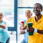 Older adult performing strength exercises such as sit-to-stand and step-ups to improve muscle strength and prevent falls.
