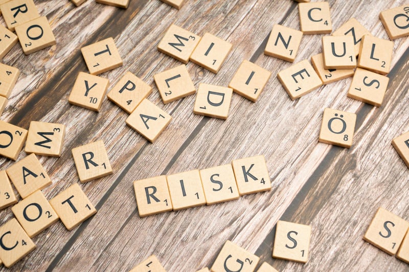 Scrabble tiles spelling the word “risk” representing fall risk identification and home safety evaluation for older adults